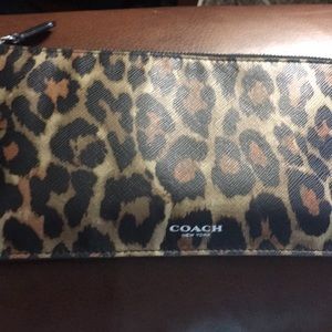 Coach zipper pouch.